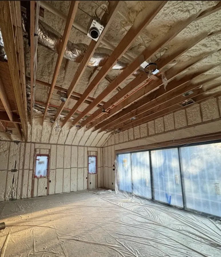 Interior walls and ceiling insulated with spray foam during new construction in East Grand Forks
